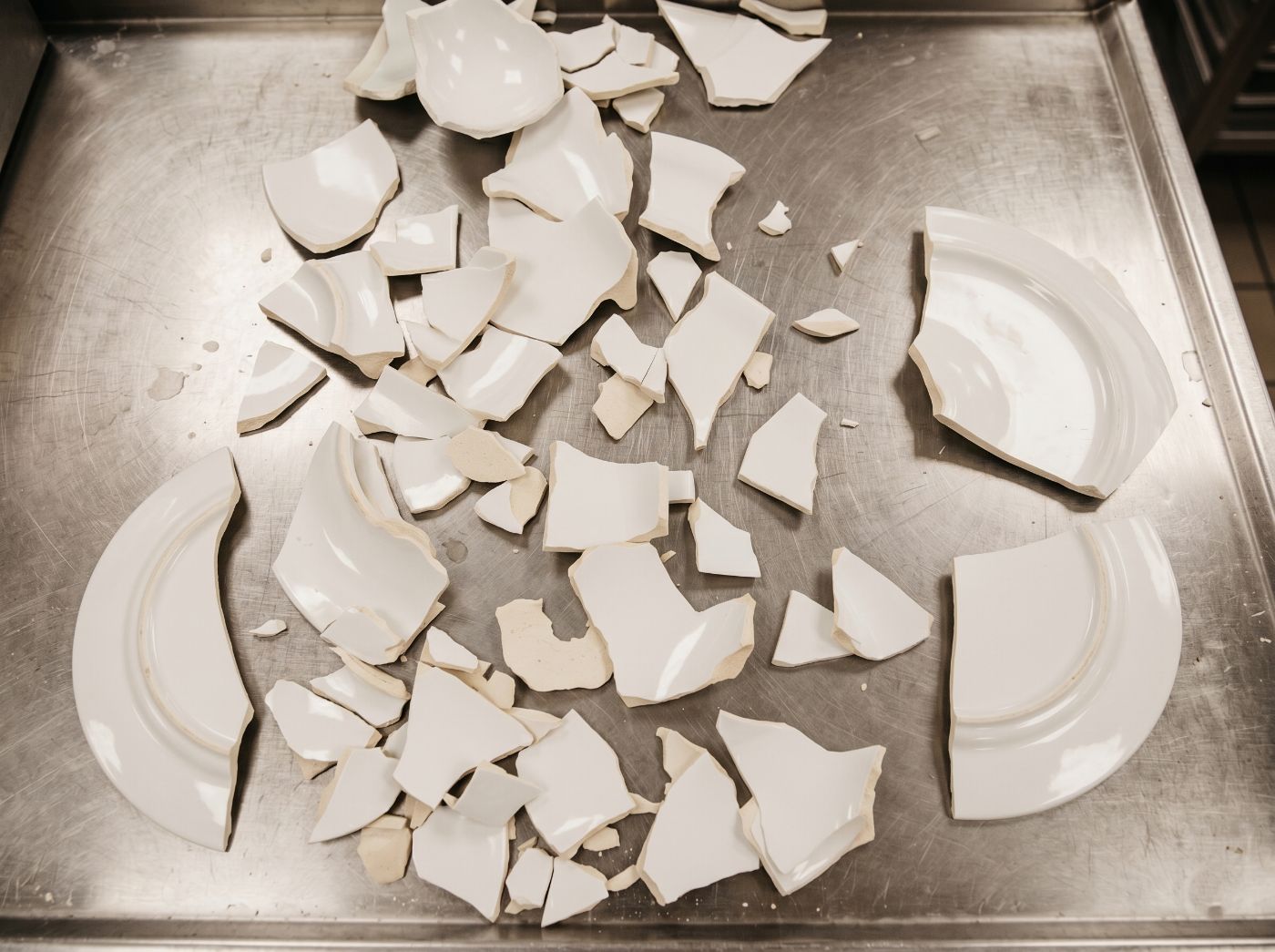 A chipped, broken porcelain plate