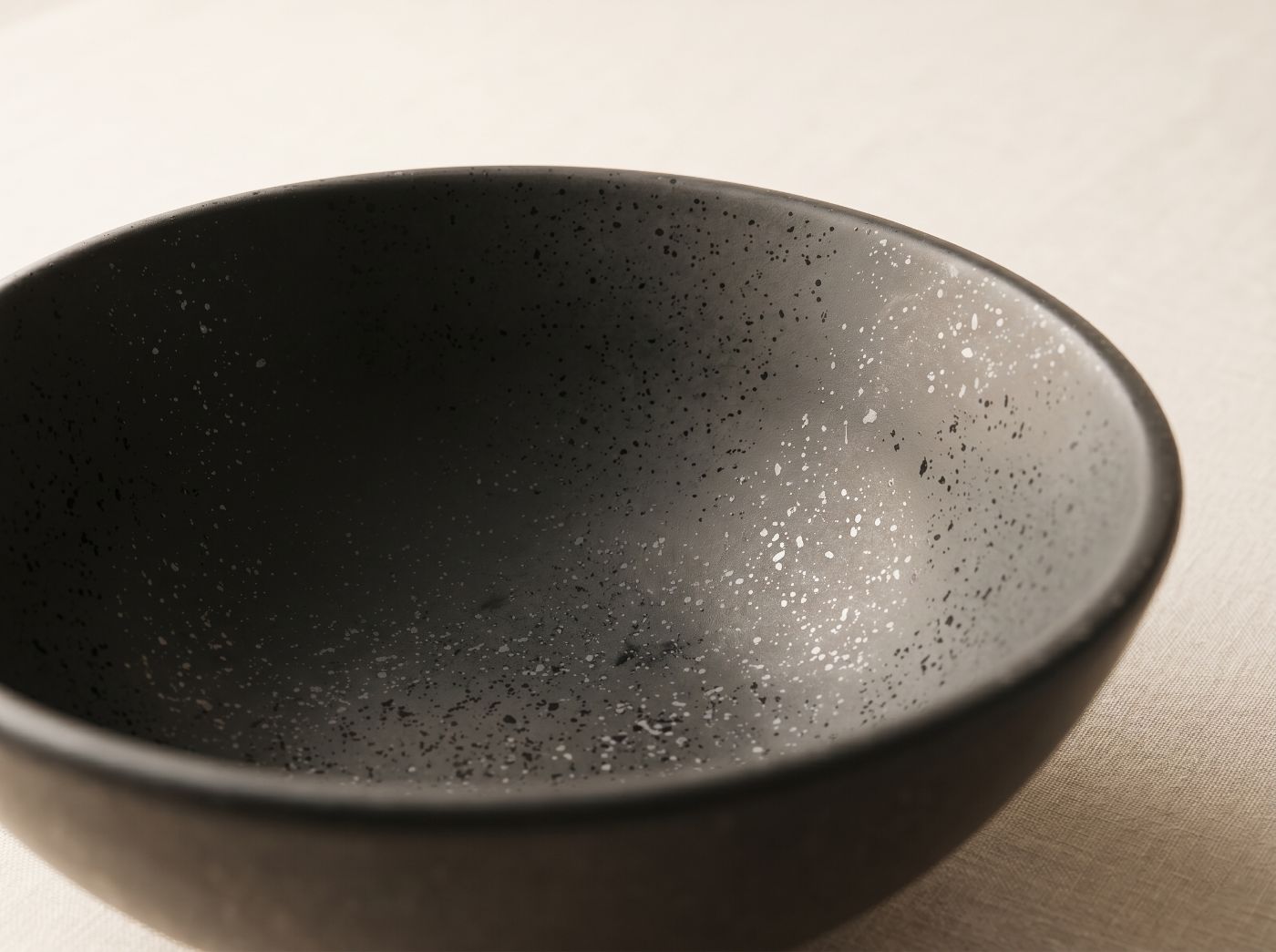 A textured sage bio-composite bowl, finish indistinguishable from porcelain